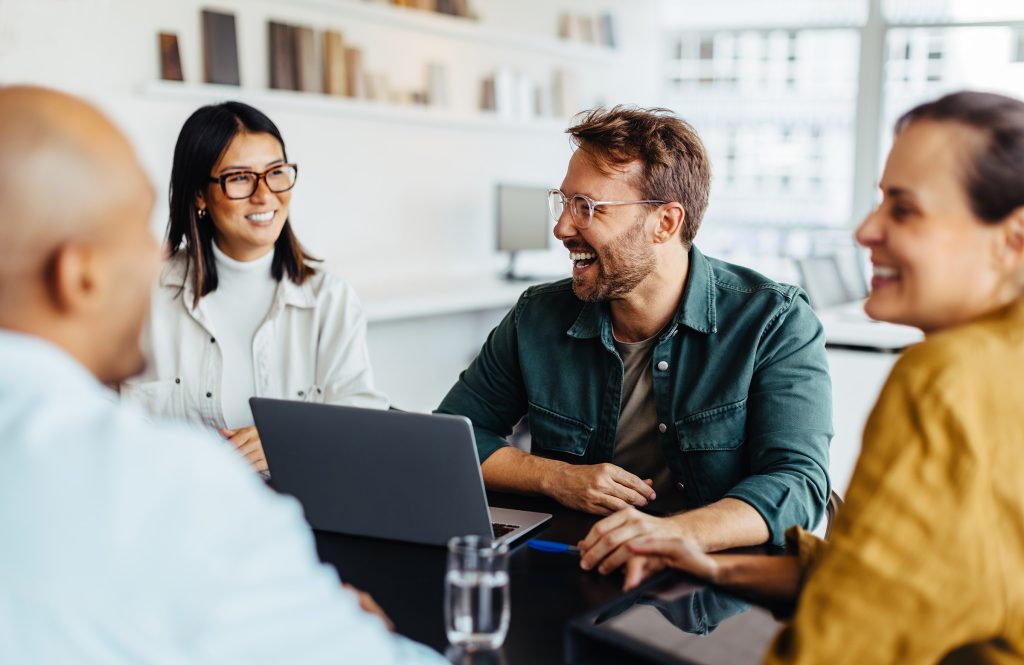 Image of people discussing wellness jobs.