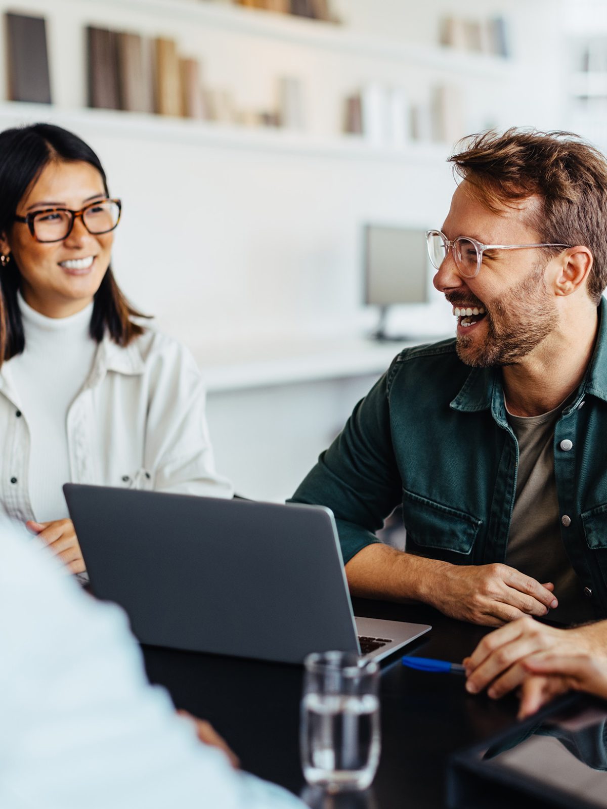 Image of people discussing wellness jobs.