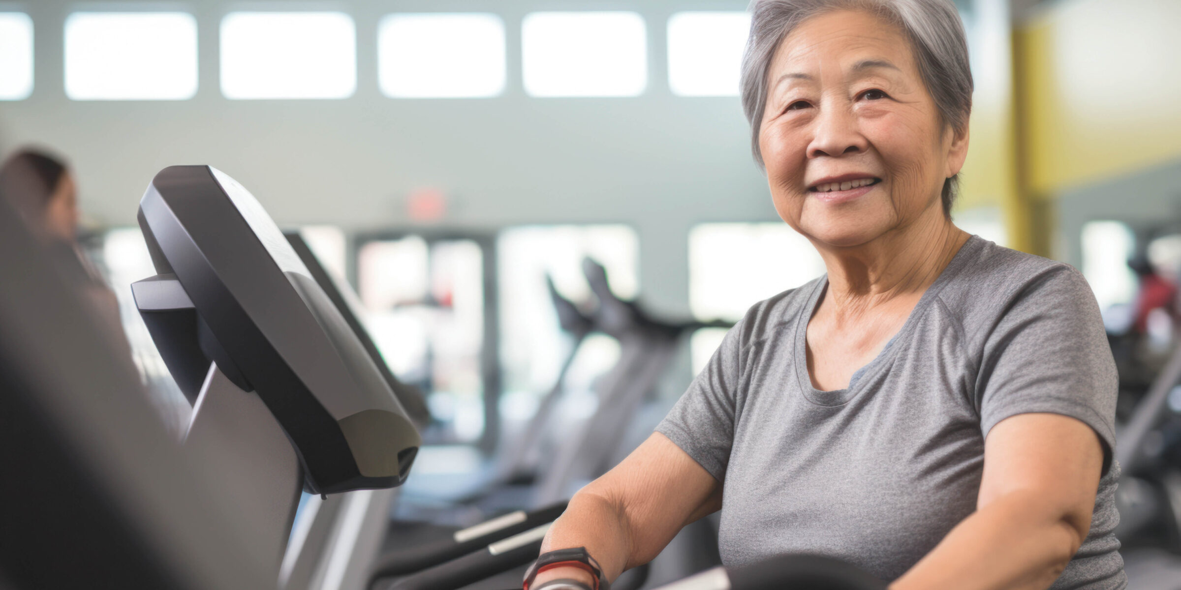 women working out at an outsourced fitness facility management gym.